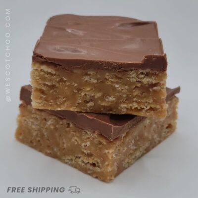 Two homemade Scotcheroos stacked on top of each other showing gooey peanut butter crispy rice base and smooth chocolate butterscotch topping, best no-bake dessert bar for peanut butter lovers, gluten-free chocolate peanut butter treat, sweet snack bar for gifting, party, or lunchbox dessert idea.