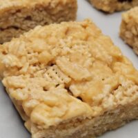 Close-up of a soft and chewy peanut butter bar with a smooth golden texture, easy no-bake dessert made with pantry ingredients, gluten-free peanut butter snack bar for kids and adults, high-protein sweet treat for lunchboxes, parties, or on-the-go snacking.