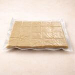 Vacuum sealed Scotcheroo bars packaged flat to lock in freshness before shipping