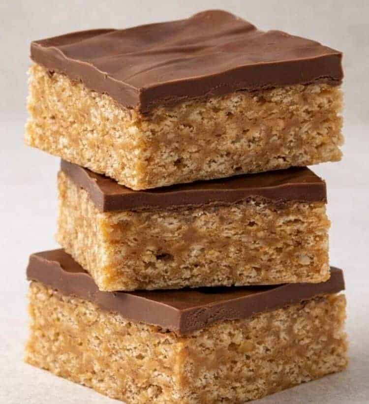 Dessert Catering Scotcheroo Bars Handcrafted Scotcheroo bars with peanut butter, chocolate, and butterscotch stacked for a dessert catering event.